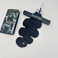 JAZZWIGS Raw Vietnamese body wave hair bundle in natural black, laid flat with a branded display clip.