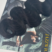 Close-up of the curled ends of a JAZZWIGS Raw Vietnamese body wave hair bundle in natural black.