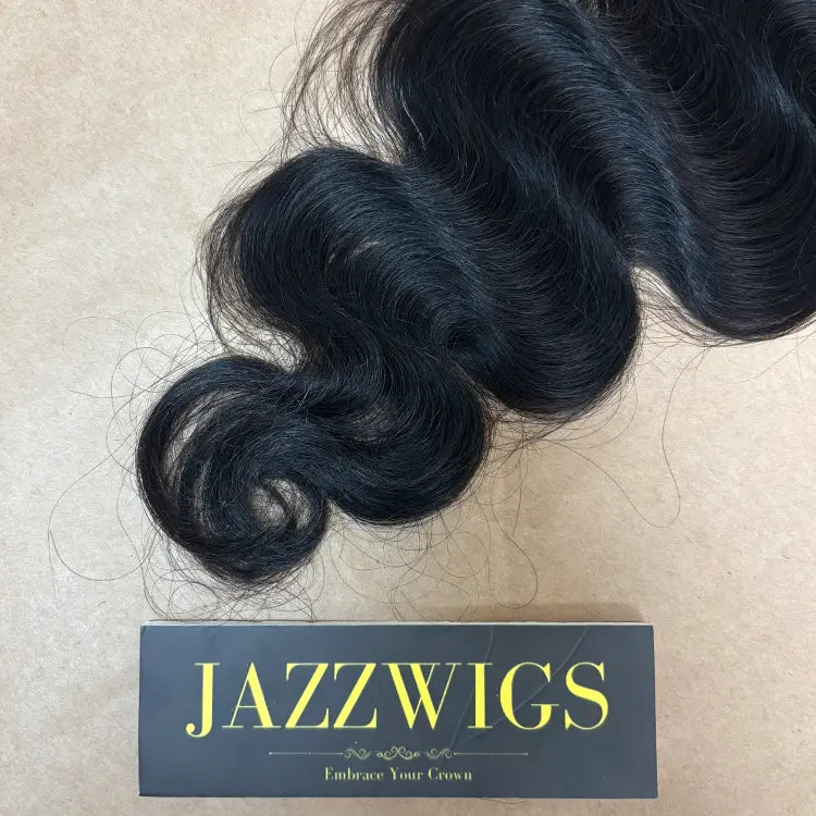Soft raw body wave bundles with 5x5 HD lace closure for natural hairline.