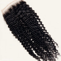 HD lace detail on curly human hair closure in natural black.