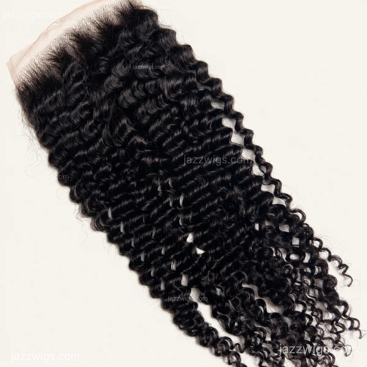 HD lace detail on curly human hair closure in natural black.