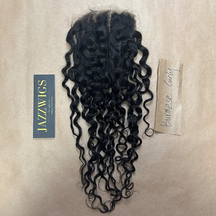 Natural-looking Burmese curly Black hair using a 7x7 HD lace closure.