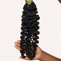 Handheld view of the ends of #1B Burmese Curly Feather Crochet human hair