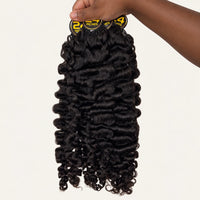 Hanging view of #1B Burmese Curly Feather Crochet human hair showing the full curl pattern
