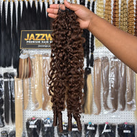 JAZZWIGS #4 Brown Burmese Water Curly Feather Crochet human hair, handheld side view of the curl pattern.