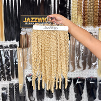 JAZZWIGS #613 Blonde Burmese Water Curly Feather Crochet Human Hair, multiple hair groups displayed on a hanger in the showroom
