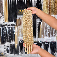 JAZZWIGS #613 Blonde Burmese Water Curly Feather Crochet Human Hair, handheld showroom view of the curl pattern and ends