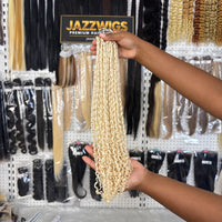JAZZWIGS #613 Blonde Pixie Curly Feather Crochet Human Hair, handheld showroom view showing the ends