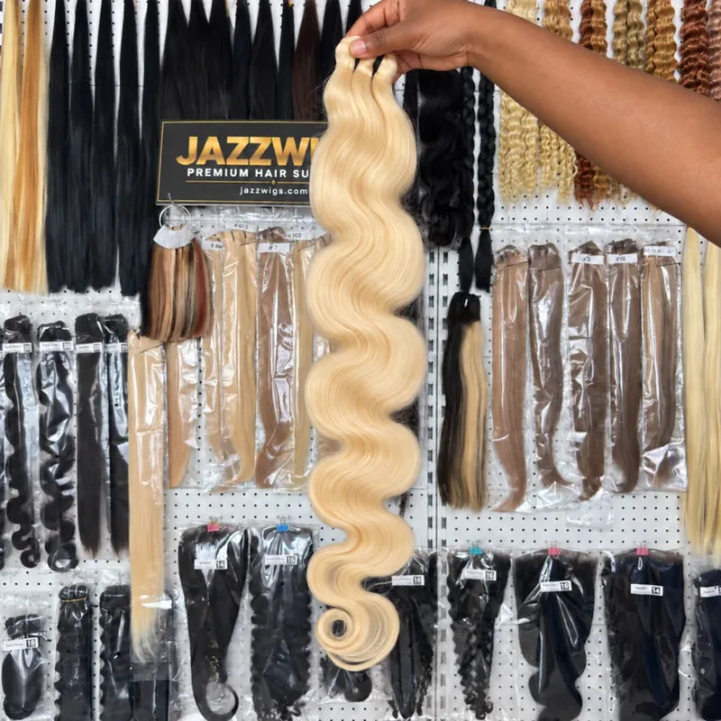 JAZZWIGS #613 blonde raw Body Wave hair displayed in the showroom