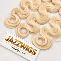 Close-up of #613 blonde raw Body Wave hair showing smooth waves and ends