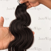 JAZZWIGS #1B Natural Black Body Wave Feather Crochet Human Hair — Hand-held wave and strand detail