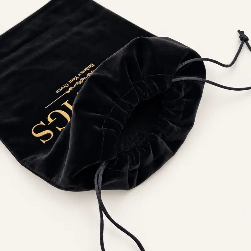 Close-up of the JAZZWIGS plush bag opening, stitching and drawstrings