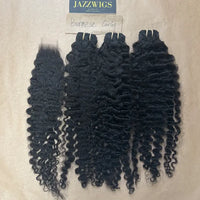 Defined Burmese curly texture paired with a 2x6 HD lace closure and natural hairline.