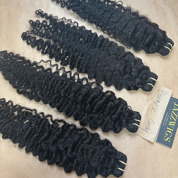 Full and bouncy raw Vietnamese Burmese curly Black hair bundles.