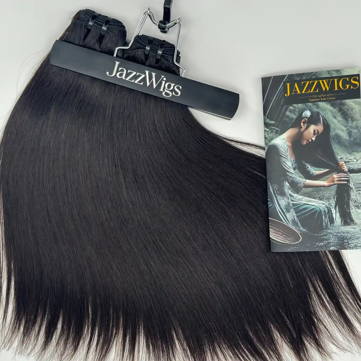 Raw Vietnamese Straight Hair 2 Bundle close product display with JAZZWIGS brochure, natural black straight human hair showing smooth texture and full ends.