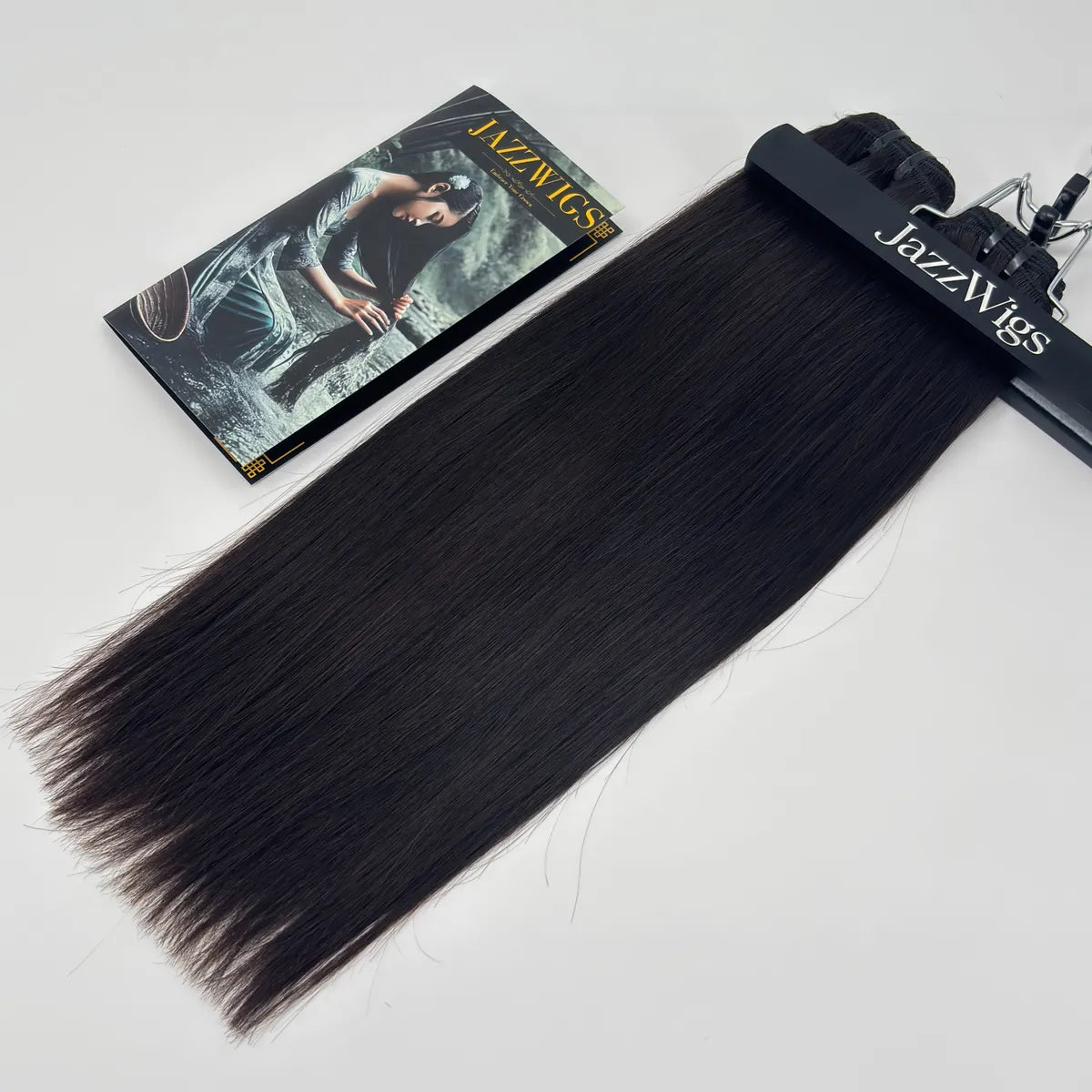 JAZZWIGS Raw Vietnamese Straight Hair 2 Bundle displayed on branded hanger with brochure, smooth natural black straight human hair bundles.