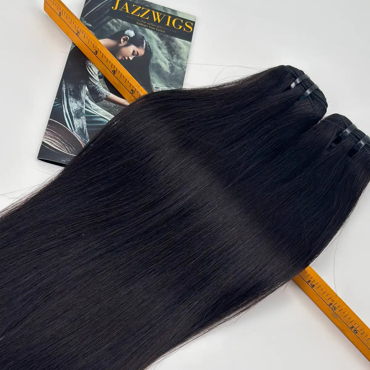 Raw Vietnamese Straight Hair 2 Bundle length and texture detail shown with ruler and JAZZWIGS brochure, natural black straight human hair bundles.