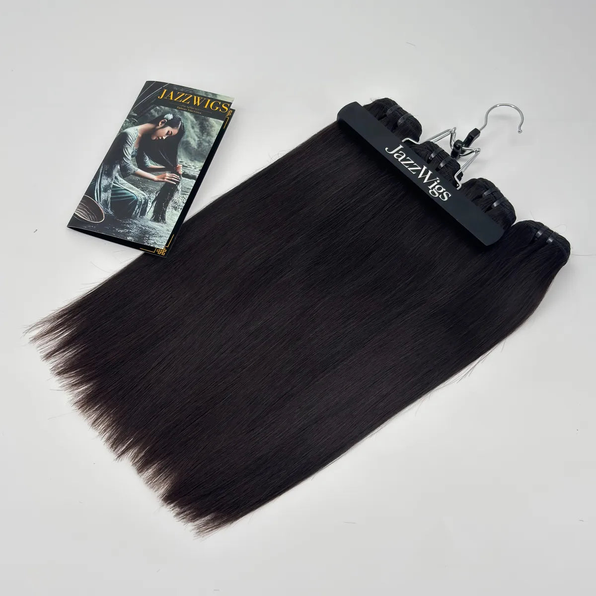 JazzWigs Raw Vietnamese Straight Hair 4 Bundle Deal on hanger in natural black, smooth straight texture, white background.