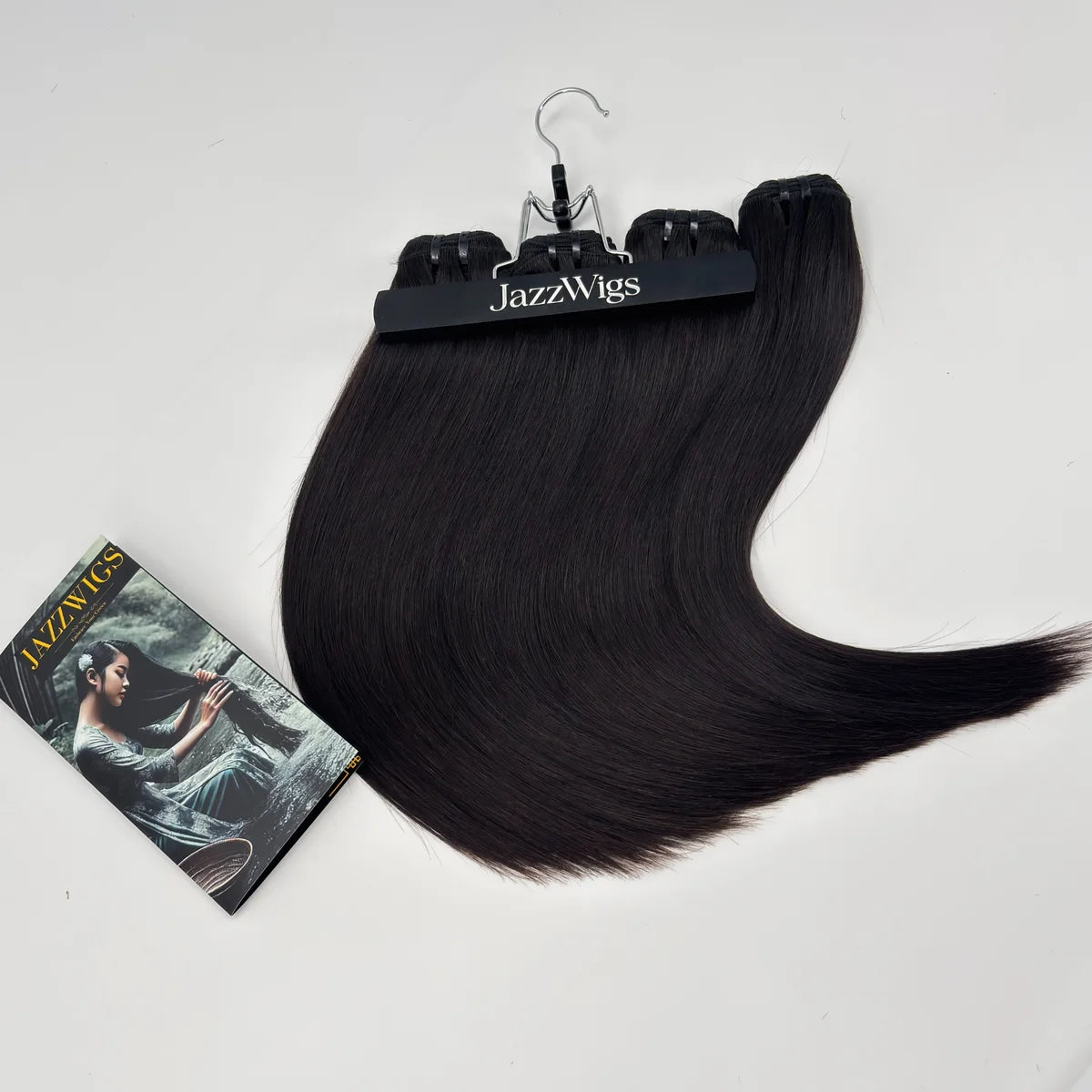 JazzWigs Raw Vietnamese Straight Hair 4 Bundles in natural black arranged in a curved display with branded card on white background.