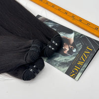 Close-up of JazzWigs Raw Vietnamese Straight Hair bundle wefts and machine-sewn tracks with measuring ruler.