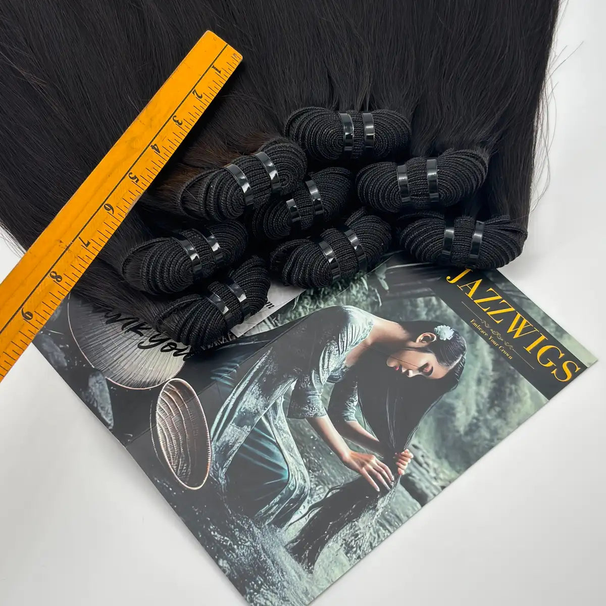Raw Vietnamese Straight Hair weft rolls and ruler detail showing bundle construction for wholesale human hair buyers.