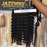 JAZZWIGS Virgin Cambodian Deep Wave human hair in natural black #1B, multiple bundles displayed on a hanger.