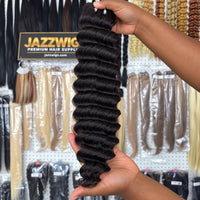 JAZZWIGS Virgin Cambodian Deep Wave human hair in natural black #1B, handheld single-bundle showroom view.