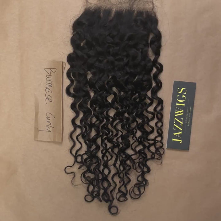 Skinlike 6x6 HD lace Burmese curly closure offering a realistic hairline.