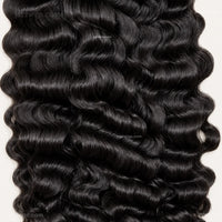Natural black curly human hair bundles for sew-in installs and wig making.