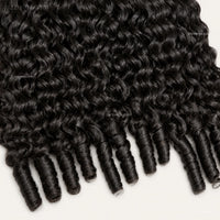 Curly human hair bundle texture detail.