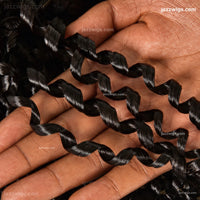 Natural black curly human hair bundles for sew-in installs and wig making.